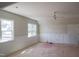 Spacious bedroom with large windows, trim detail, and ceiling fan at 7301 Wexford Woods Ln, Wake Forest, NC 27587