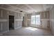 Bedroom showcasing natural light and doorway access, creating an inviting and customizable space at 7301 Wexford Woods Ln, Wake Forest, NC 27587