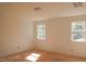 Bright bedroom features trim and two windows offering ample natural light at 7301 Wexford Woods Ln, Wake Forest, NC 27587