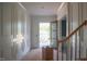 Grand entryway featuring white wainscoting, trim and a beautiful front door with sidelights at 7301 Wexford Woods Ln, Wake Forest, NC 27587
