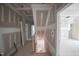 Spacious hallway and stairway, awaiting final touches for a welcoming and connected living space at 7301 Wexford Woods Ln, Wake Forest, NC 27587