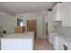 Bright, modern kitchen with white cabinetry, marble countertops, gold hardware and stainless steel appliances at 7301 Wexford Woods Ln, Wake Forest, NC 27587