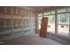 Spacious living room boasting large windows, board and batten wall accents, ready for final personalization at 7301 Wexford Woods Ln, Wake Forest, NC 27587
