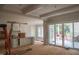 Open floorplan featuring a modern kitchen with marble countertops, an island, and a dining/living area with a sliding glass doors at 7301 Wexford Woods Ln, Wake Forest, NC 27587