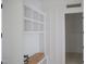 Built-in white shelving unit with natural light and trim detail at 7301 Wexford Woods Ln, Wake Forest, NC 27587