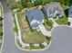 Aerial view of a two-story home with a landscaped yard and charming curb appeal in a suburban neighborhood at 7510 Latteri Ct, Raleigh, NC 27613
