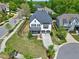 Aerial view of home with a well-maintained lawn and mature trees at 7510 Latteri Ct, Raleigh, NC 27613