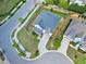 Aerial view of the property with well-maintained landscaping, sidewalks, and curb appeal at 7510 Latteri Ct, Raleigh, NC 27613