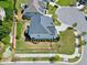 Aerial view of a two-story home with a fenced yard in a suburban neighborhood at 7510 Latteri Ct, Raleigh, NC 27613