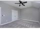 Bright bedroom with a ceiling fan and large closet, offering ample space and a cozy atmosphere at 7510 Latteri Ct, Raleigh, NC 27613