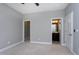 Neutral bedroom featuring carpet floors, closet, an ensuite bathroom, and neutral walls at 7510 Latteri Ct, Raleigh, NC 27613