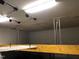 Garage with ceiling mounted storage racks, maximizing space and organization at 7510 Latteri Ct, Raleigh, NC 27613