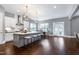 Spacious kitchen with an island, white cabinets, and stainless-steel appliances at 7510 Latteri Ct, Raleigh, NC 27613