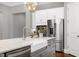 The kitchen features stainless steel appliances and a sink in the island at 7510 Latteri Ct, Raleigh, NC 27613