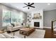 Cozy living room with a fireplace, built-in shelving, and a comfortable sofa at 7510 Latteri Ct, Raleigh, NC 27613