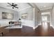 Open-concept office features a modern desk, wainscoting, and hardwood floors at 7510 Latteri Ct, Raleigh, NC 27613