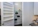 Walk-in pantry with adjustable shelving for storage of groceries and kitchen essentials at 7510 Latteri Ct, Raleigh, NC 27613