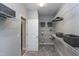 Organized walk-in closet with wire shelving, baskets, and a functional design for optimal storage at 7510 Latteri Ct, Raleigh, NC 27613