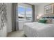 Bright bedroom featuring a large window, neutral decor, and comfortable bedding at 766 Dorset Stream Dr, Fuquay Varina, NC 27526