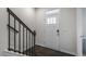 Bright entryway features a white front door with glass and dark wood-look flooring at 766 Dorset Stream Dr, Fuquay Varina, NC 27526