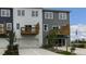 Townhome exterior showcasing balconies, a garage, manicured landscaping, and convenient front access at 766 Dorset Stream Dr, Fuquay Varina, NC 27526