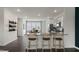 Kitchen bar featuring granite countertops, modern cabinetry, and stainless appliances at 766 Dorset Stream Dr, Fuquay Varina, NC 27526