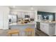 Bright kitchen featuring stainless steel appliances, gray cabinets, and granite countertops at 766 Dorset Stream Dr, Fuquay Varina, NC 27526