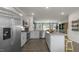 Modern kitchen with granite countertops, stainless steel appliances and center island at 766 Dorset Stream Dr, Fuquay Varina, NC 27526