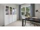 Stylish home office with modern desk, storage, and a bright window view at 766 Dorset Stream Dr, Fuquay Varina, NC 27526