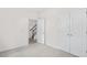 Clean bedroom showcasing plush carpeting, a closet, and an entrance, offering comfort and functionality at 768 Dorset Stream Dr, Fuquay Varina, NC 27526