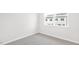 Bright bedroom with carpet, window, and neutral paint at 768 Dorset Stream Dr, Fuquay Varina, NC 27526