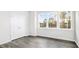 Bedroom featuring three windows providing natural light and closet at 768 Dorset Stream Dr, Fuquay Varina, NC 27526