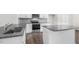 Contemporary kitchen featuring granite countertops, stainless steel appliances, and a center island at 768 Dorset Stream Dr, Fuquay Varina, NC 27526