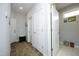 Hallway with multiple doors, a patterned rug, and access to a separate room at 769 Ashley Woods Dr, Gibsonville, NC 27249
