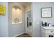 Hallway with decoratively lit inset shelving at 769 Ashley Woods Dr, Gibsonville, NC 27249