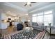Open-concept living space with a view of the modern kitchen and inviting furnishings at 769 Ashley Woods Dr, Gibsonville, NC 27249