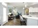 Open living space with a modern kitchen featuring a breakfast bar overlooking the cozy living room at 769 Ashley Woods Dr, Gibsonville, NC 27249