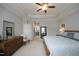Spacious main bedroom features tray ceiling, ceiling fan, and lots of natural light at 769 Ashley Woods Dr, Gibsonville, NC 27249