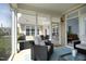 Inviting screened-in porch with a seating area and views of the surrounding backyard at 769 Ashley Woods Dr, Gibsonville, NC 27249