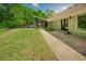 Well-maintained backyard with lush lawn, beautiful patio, and a seamless connection to the pool area at 7955 Midnight Ln, Wake Forest, NC 27587