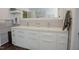 Modern bathroom featuring double sinks, white cabinets, and gray accents for a clean, updated look at 7955 Midnight Ln, Wake Forest, NC 27587