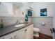 Modern bathroom featuring white vanity with gray countertop, stainless steel hardware and tile walls at 7955 Midnight Ln, Wake Forest, NC 27587