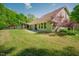 Serene backyard with lovely landscaping, patio, and a view of the house that creates a relaxing atmosphere at 7955 Midnight Ln, Wake Forest, NC 27587