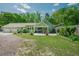 Charming home showcasing a well-manicured lawn, inviting front porch, and attached two car garage at 7955 Midnight Ln, Wake Forest, NC 27587