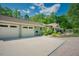 Front exterior featuring a spacious driveway, two-car garage, and a manicured lawn, perfect for parking at 7955 Midnight Ln, Wake Forest, NC 27587