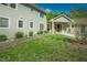 Gorgeous home showcasing the well-maintained lawn, sage siding, and mature landscaping at 7955 Midnight Ln, Wake Forest, NC 27587