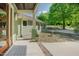 Inviting front porch featuring a modern door, neutral color scheme, and meticulous landscaping at 7955 Midnight Ln, Wake Forest, NC 27587