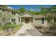 Lovely exterior home view showcasing a charming walkway, sage green siding, and a welcoming entrance at 7955 Midnight Ln, Wake Forest, NC 27587
