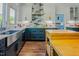 Bright kitchen featuring stainless appliances, shaker cabinets, and tile backsplash at 7955 Midnight Ln, Wake Forest, NC 27587