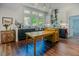 Bright kitchen featuring natural light, stainless steel sink and appliances, and custom cabinetry at 7955 Midnight Ln, Wake Forest, NC 27587